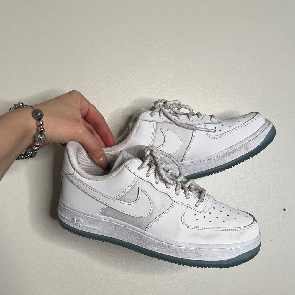 Nike Air White sneaker with blue bottom stripe laces